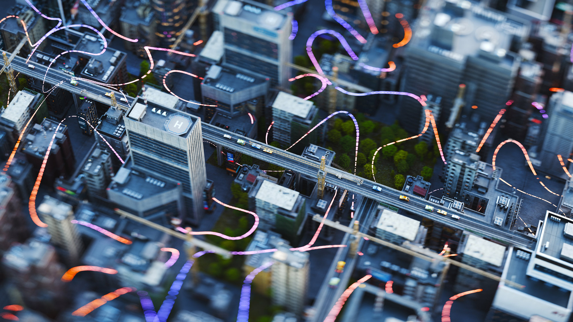 A digitally generated aerial image showing a large city with glowing colorful lines representing invisible wireless connections and data communication between buildings.